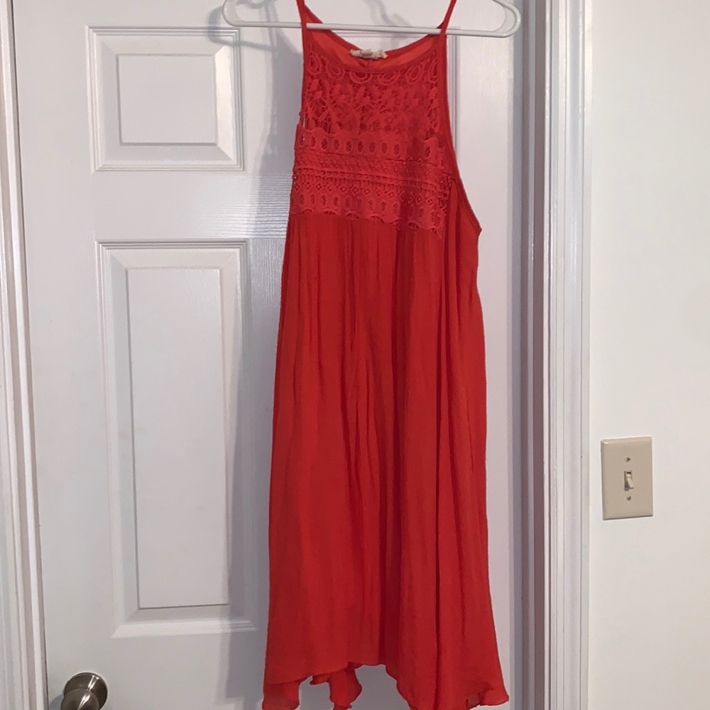 Coral peach sleeveless dress with neckline detail